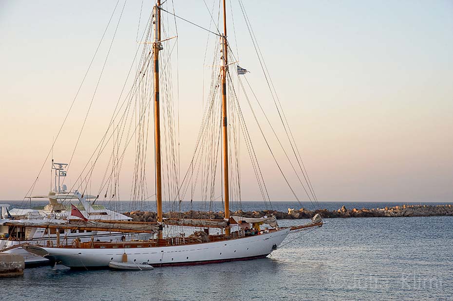 Sailing boat at the port of Fry, Kassos island, Dodecanese, Greece