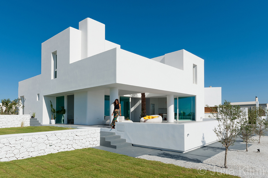 Summer house formed of bright white blocks